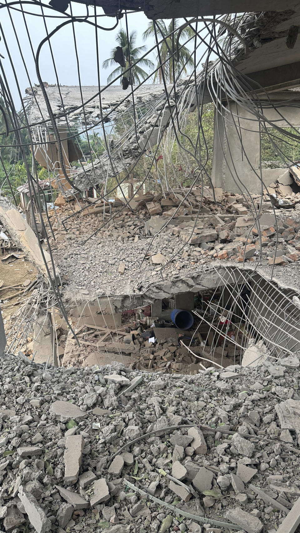 This undated photo released by the Free Burma Rangers, shows a destruction after a Buddhist monastery sheltering civilians displaced by fighting in the town of Papun, Karen state, Myanmar was attacked on March 31, 2024 by a regime warplane. (Free Burma Rangers via AP)