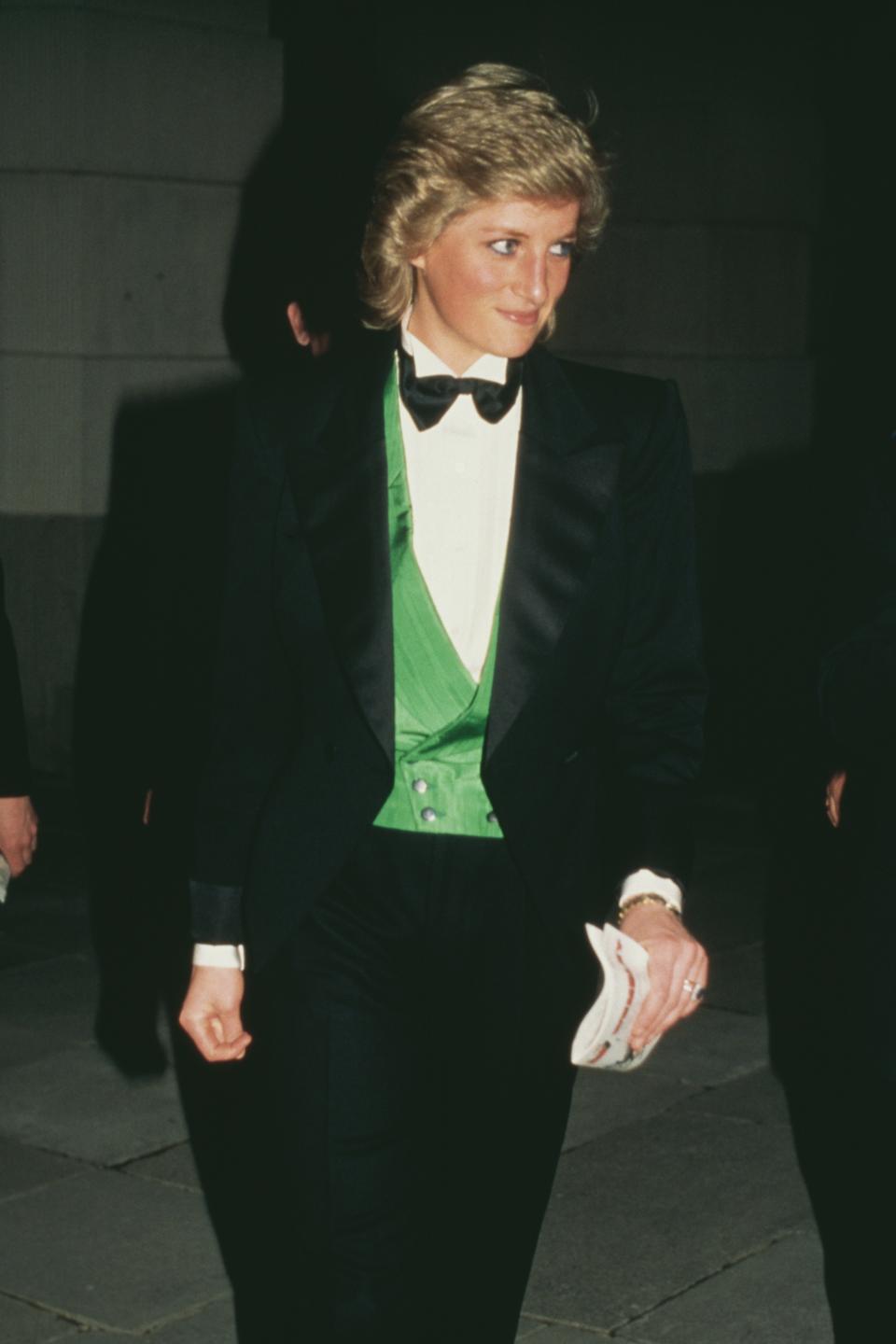 Diana, Princess of Wales (1961 - 1997) attends a charity greyhound racing event at Wembley Stadium in London, UK, 20th April 1988. She is wearing a green Hackett waistcoat and a Catherine Walker suit and a bow tie.