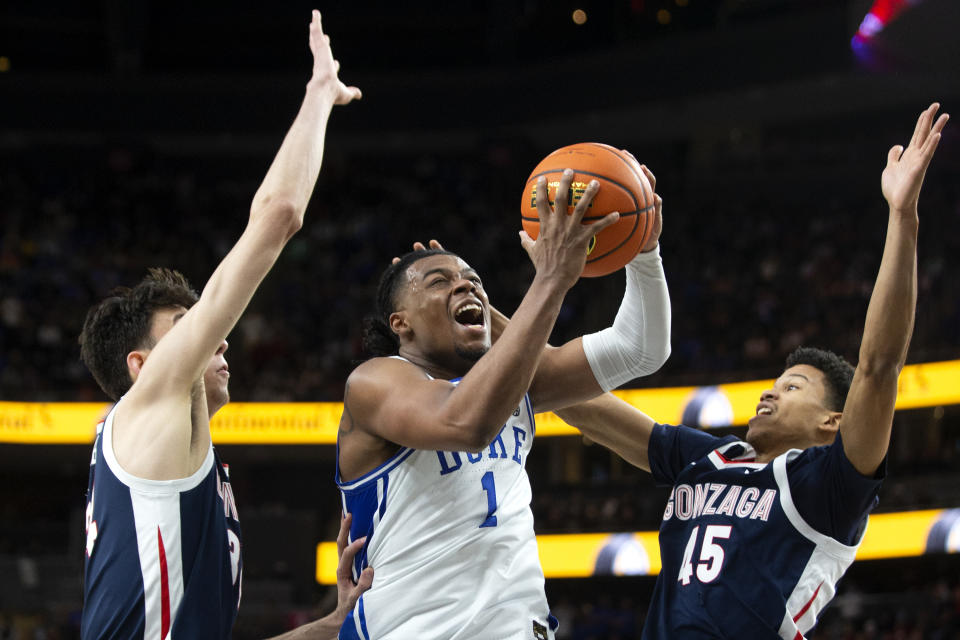 Duke guard Trevor Keels (1) shoots against Gonzaga center Chet Holmgren, left, and guard Rasir Bolton (45) during the second half of an NCAA college basketball game Friday, Nov. 26, 2021, in Las Vegas. (AP Photo/Ellen Schmidt)