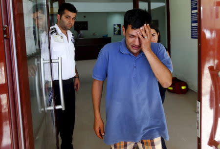 Abdullah Kurdi, father of three-year old Aylan Kurdi, cries as he leaves a morgue in Mugla, Turkey, September 3, 2015. REUTERS/Murad Sezer