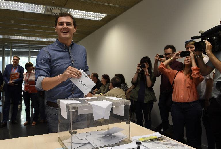 Ciudadanos leader Albert Rivera casts his ballot in Spain's municipal and regional elections at a polling station in Barcelona on May 24, 2015