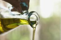 <p>Now that the low-fat life is a thing of the past, you've probably considered pouring olive oil over your entire life. </p><p>Really, though, with about a thousand different types of cooking oils seemingly deemed a-okay now, it's tricky to tell which are <em>actually </em>healthy — and which to use for different recipes and cooking methods.<br></p><p>Two key factors to keep in mind: <a href="https://www.womenshealthmag.com/food/a19484751/saturated-fat-health/" rel="nofollow noopener" target="_blank" data-ylk="slk:saturated fat;elm:context_link;itc:0;sec:content-canvas" class="link ">saturated fat</a> content and smoke point. </p><p>Though the <a href="https://www.womenshealthmag.com/weight-loss/a19434332/what-is-the-keto-diet/" rel="nofollow noopener" target="_blank" data-ylk="slk:keto diet;elm:context_link;itc:0;sec:content-canvas" class="link ">keto diet</a> has made butter and coconut oil (both of which are high in saturated fat) crazy-popular, the USDA Dietary Guidelines for Americans <em>still</em> recommends limiting saturated fat to less than 10% of your daily calories, choosing oils higher in unsaturated fat instead. </p><p>Plus, the right smoke point (the temp at which an oil starts burning and breaking down) is also crucial — especially when you're cooking at high heat, like searing a steak. </p><p>Here, dietitians break down seven of the healthiest cooking oils in the game (and three questionable ones), so you can keep your pantry as healthy — and your cooking adventures as catastrophe-free—as possible.<br></p>