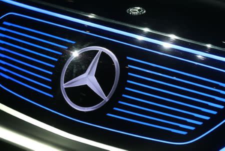 A Mercedes sign is seen on the car before the Daimler annual shareholder meeting in Berlin, Germany, March 29, 2017. REUTERS/Hannibal Hanschke