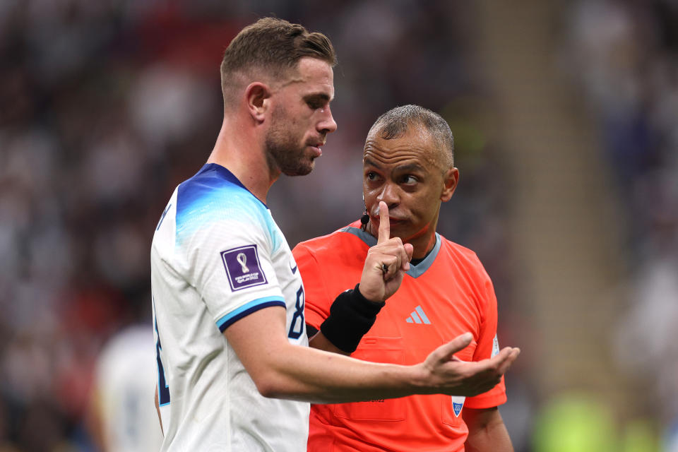 AL KHOR, QATAR - DECEMBER 10: Jordan Henderson of England and Referee Wilton Sampaio interact during the FIFA World Cup Qatar 2022 quarter final match between England and France at Al Bayt Stadium on December 10, 2022 in Al Khor, Qatar. (Photo by Elsa/Getty Images)