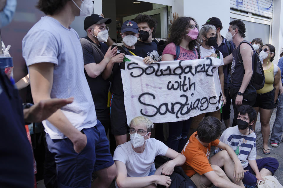 Workers block the entrance of a depot for German startup Gorillas, a grocery delivery company, to protest the firing of a colleague in Berlin, Germany, Thursday, June 10, 2021. Founded just last year, Gorillas benefited from surging demand for quick grocery deliveries during the pandemic. The company operates in dozens of cities across Germany, France, Italy, the Netherlands and Britain, and has already set its sights on New York. (AP Photo/Markus Schreiber)