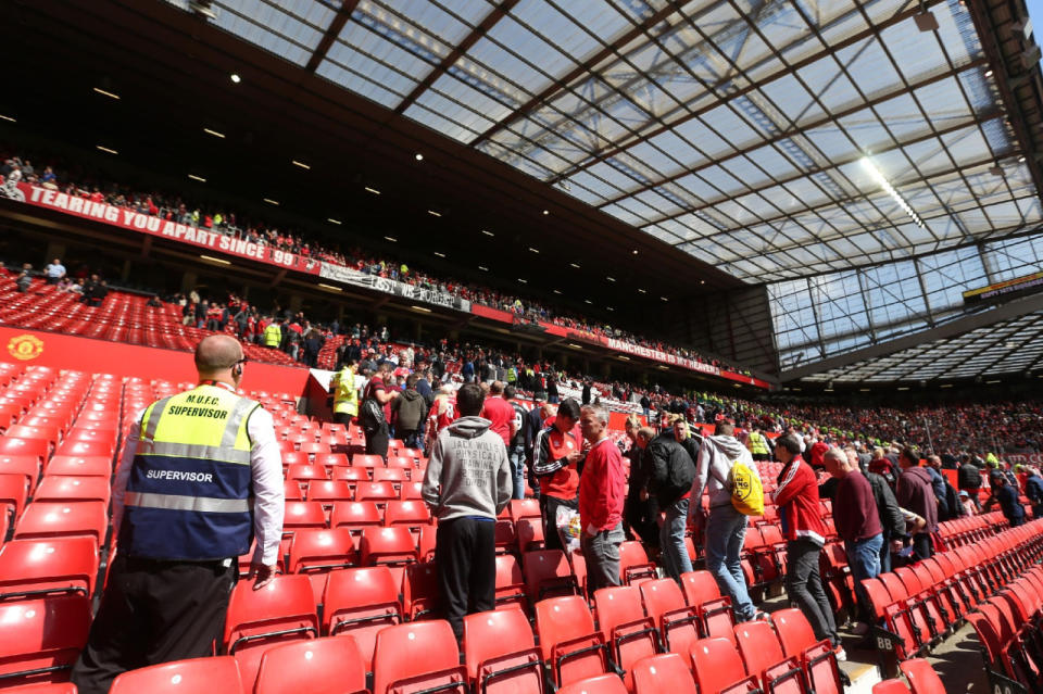 Fans are evacuated and the match between Manchester United and AFC Bournemouth at Old Trafford in Manchester, England, is postponed on May 15, 2016, after a suspicious package was found. (Alex Morton/Getty Images)