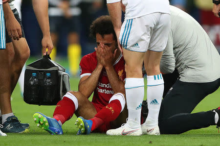 Soccer Football - Champions League Final - Real Madrid v Liverpool - NSC Olympic Stadium, Kiev, Ukraine - May 26, 2018 Liverpool's Mohamed Salah looks dejected as he receives medical treatment after sustaining an injury REUTERS/Hannah McKay