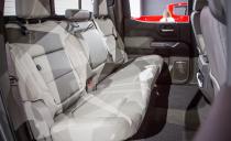 <p>The Silverado’s larger footprint improves rear-seat comfort in the four-door crew cab, as legroom grows from 40.9 inches to 43.8 inches. Along with the additional stretch-out space, Chevy managed to squeeze in two large storage bins in the rear seatbacks, as well as storage space under the rear seat bottoms.</p>