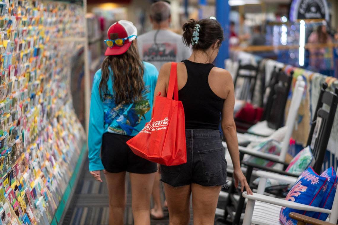 Boulineau’s Foods Plus in North Myrtle Beach, S.C. is making a transition away from plastic bags to the more environmentally friendly paper and reusable tote bags but has struggled with the cost and supply of paper bags. The local grocery has given away over 100,000 reusable bags. July 6, 2022.