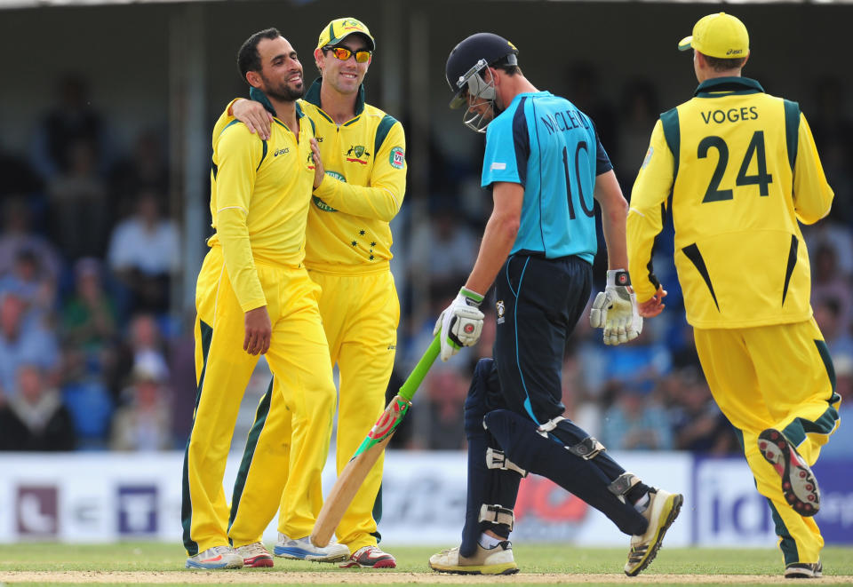 Glenn Maxwell celebrates with Fawad Ahmed.