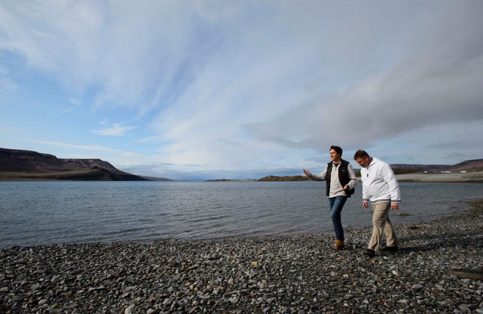 Prime Minister Justin Trudeau and PJ Akeeagok walk the shore of Pamiuja as they visit Arctic Bay, Nvt., Thursday, Aug. 1, 2019. THE CANADIAN PRESS/Sean Kilpatrick