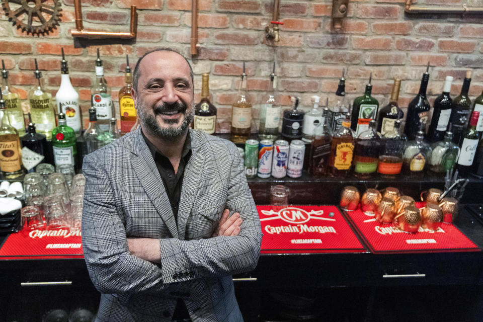 Yousef Tellawi, manager of the Bulldog Bar on H Street in Chinatown, Monday, Feb. 24, 2024, in Washington. The proposed move of the Capitals and Wizards sports teams to nearby Virginia has stoked concern in a pair of fragile Washington neighborhoods. Residents and business owners in Chinatown fear that the departure of the teams would devastate the neighborhood around the Capital One Arena. (AP Photo/Manuel Balce Ceneta)