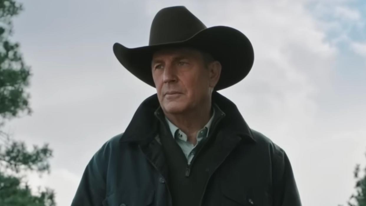  John Dutton in hat outdoors in Yellowstone. 