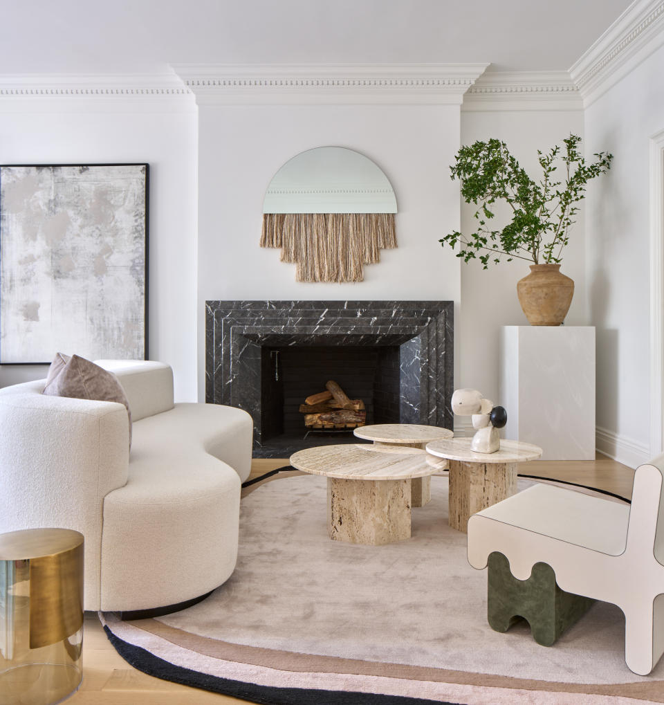 A living room with pale pink rug