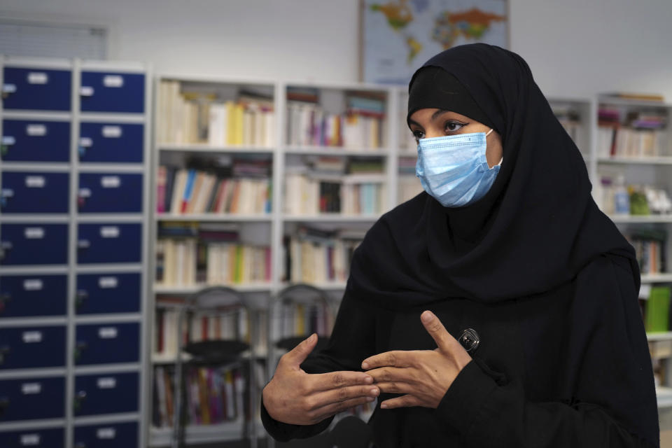 Rafika, who asked to be identified only by her first name, speaks to The Associated Press at the MHS, Meo High School private college, in Paris Tuesday, Feb. 9, 2021. The MHS school “is a school like me, what I call the France of today,” said Rafika. “It’s a real melting pot.” (AP Photo/Francois Mori)