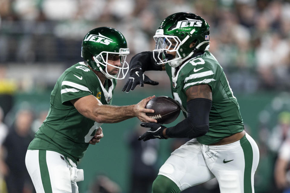 Aaron Rodgers #8 of the New York Jets hands the ball off to Braelon Allen #0 of the New York Jets during an NFL football game between the New York Jets and the New England Patriots at MetLife Stadium on September 19, 2024 in East Rutherford, New Jersey. (Photo by Michael Owens/Getty Images)