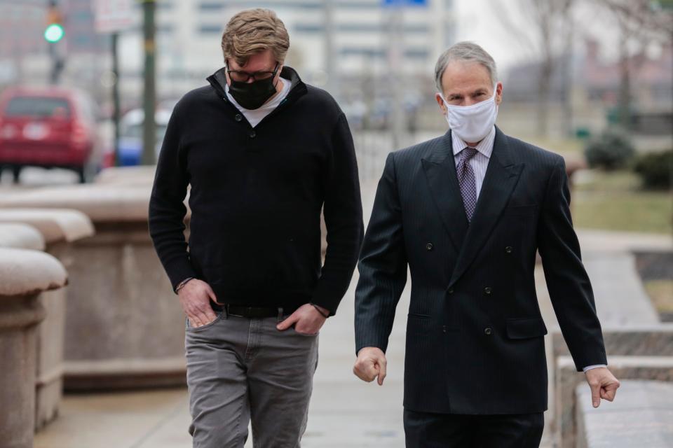 Dustin Thompson, left, of Columbus, arrives with his then-lawyer, Sam Shamansky, to turn himself in on Monday, Jan. 25, 2021 at the Joseph P. Kinneary U.S. District Courthouse in Columbus, Ohio. Shamansky unsuccessfully argued at trial that Trump was to blame for Thompson's participation in the Jan. 6, 2021 insurrection.
(Photo: Joshua A. Bickel/Columbus Dispatch)