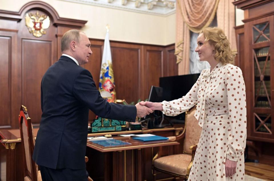 Russian President Vladimir Putin meets with Commissioner for Children's Rights Maria Lvova-Belova at the Kremlin in Moscow on March 9, 2022. (Mikhail Klimentyev /SPUTNIK/AFP via Getty Images)