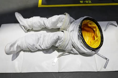 The space suit pants of the NASA Commercial Crew Astronaut Josh Cassada are seen on a pool desk awaiting his arrival at NASA's Neutral Buoyancy Laboratory (NBL) training facility near the Johnson Space Center in Hou