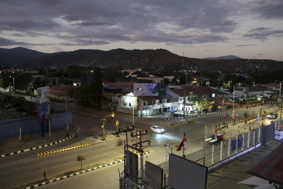 A street light is seen during a sunrise in Dili, East Timor Sunday, Sept. 8, 2024. (AP Photo/Firdia Lisnawati)