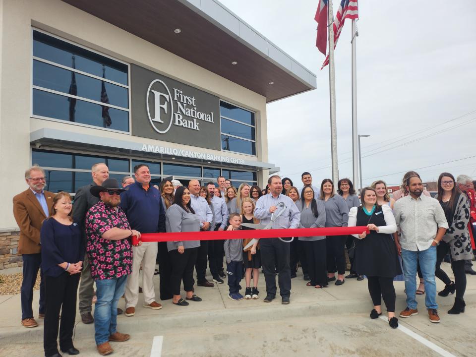 The Canyon Chamber of Commerce commemorates the grand opening of the First National Bank Amarillo/Canyon location with a ribbon cutting ceremony Thursday.