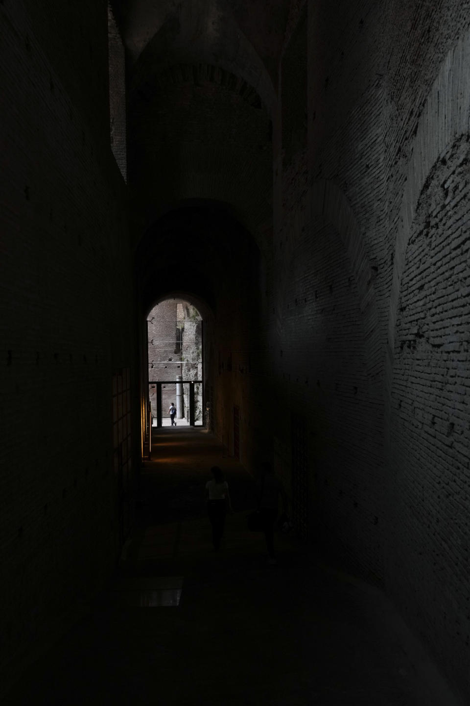 A visitor walks in the newly restored domus Tiberiana, one of the main imperial palaces, during the press preview on Rome's Palatine Hill, in Rome, Italy, Wednesday, Sept. 20, 2023. The Domus Tiberiana will reopen to the public on Sept. 21. (AP Photo/Gregorio Borgia)
