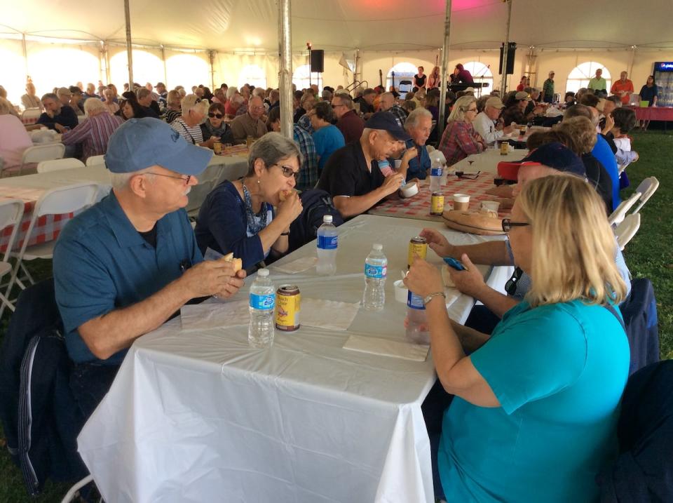 Passengers from the cruise ship Viking Star enjoy some P.E.I. food during a visit to Charlottetown on Friday.