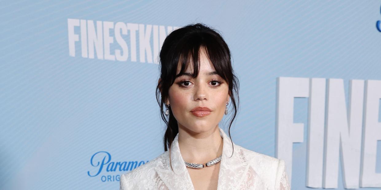 Jenna Ortega nails winter whites in see-through lace mini-dress