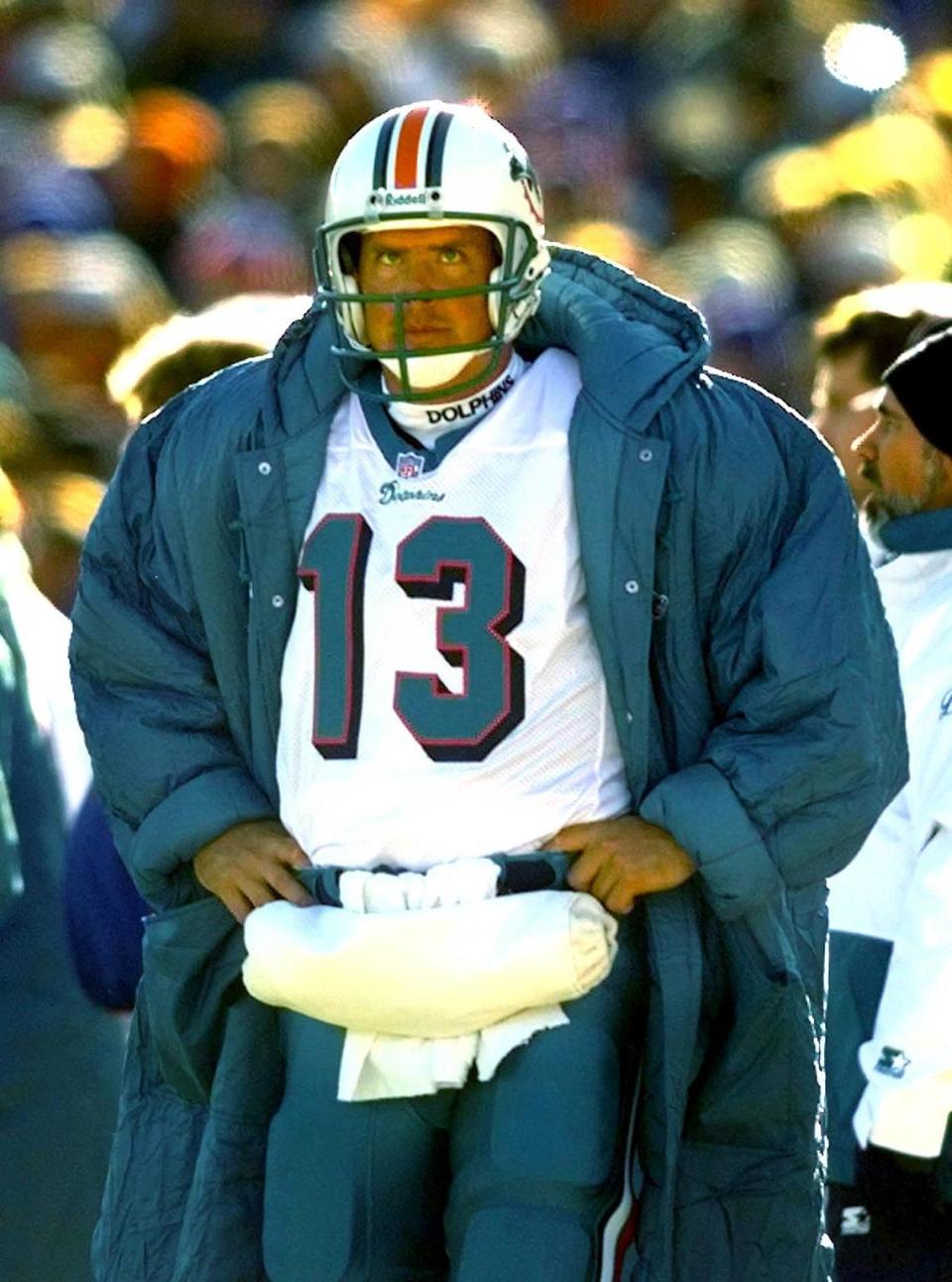 FOR SPORTS 12/28/97 PHOTO BY JOE RIMKUS JR MHS At Foxboro Stadium in Foxboro Mass.Miami Dolphins vs New England Patriots..A cold unhappy Dan Marino in 3rd Qt.