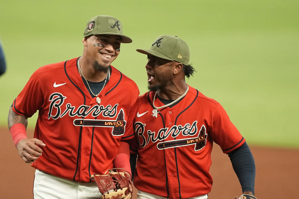 Atlanta Braves' Arcia, left, talks with Ozzie Albies, right, after Arcia made a double play in the seventh inning of a baseball game against the Seattle Mariners, Friday, May 19, 2023, in Atlanta. (AP Photo/Brynn Anderson)