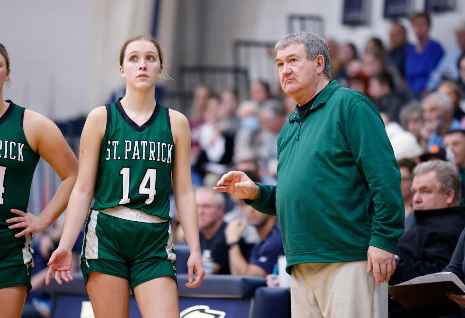 Portland St. Patrick coach Al Schrauben talks with Katelyn Russell during a game against Fowler, Tuesday, Feb. 1, 2022, in Fowler.