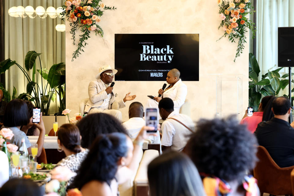 NEW YORK, NEW YORK - SEPTEMBER 08: (L-R) Dapper Dan and Symone Sanders-Townsend speak during the Black Beauty Roster lunch during New York Fashion Week - September 2023: The Shows at Spring Studios on September 08, 2023 in New York City. (Photo by Arturo Holmes/Getty Images for NYFW: The Shows)