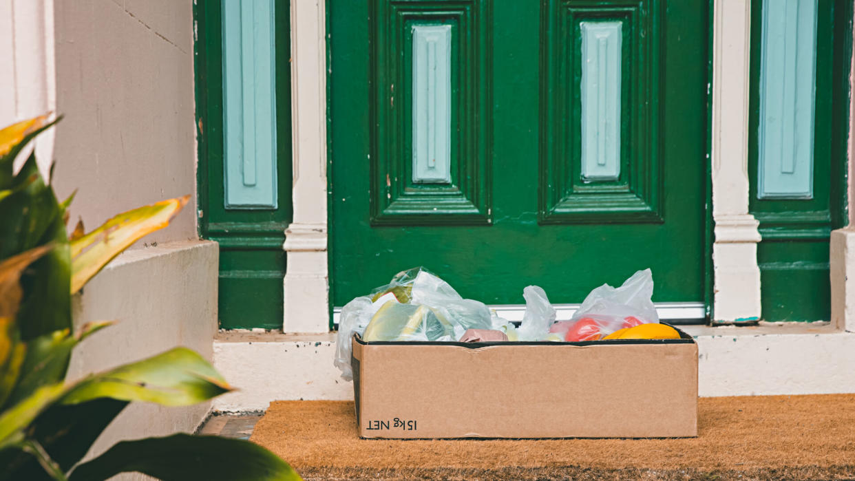 A box of fresh fruit and vegetables left at the front door during social distancing of Coronavirus.