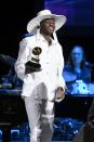 <p>While accepting his Grammy Award, the rapper wore an all-white shirt and pants combo, with a wide-brim hat to match. I mean, he does love his hats. </p>