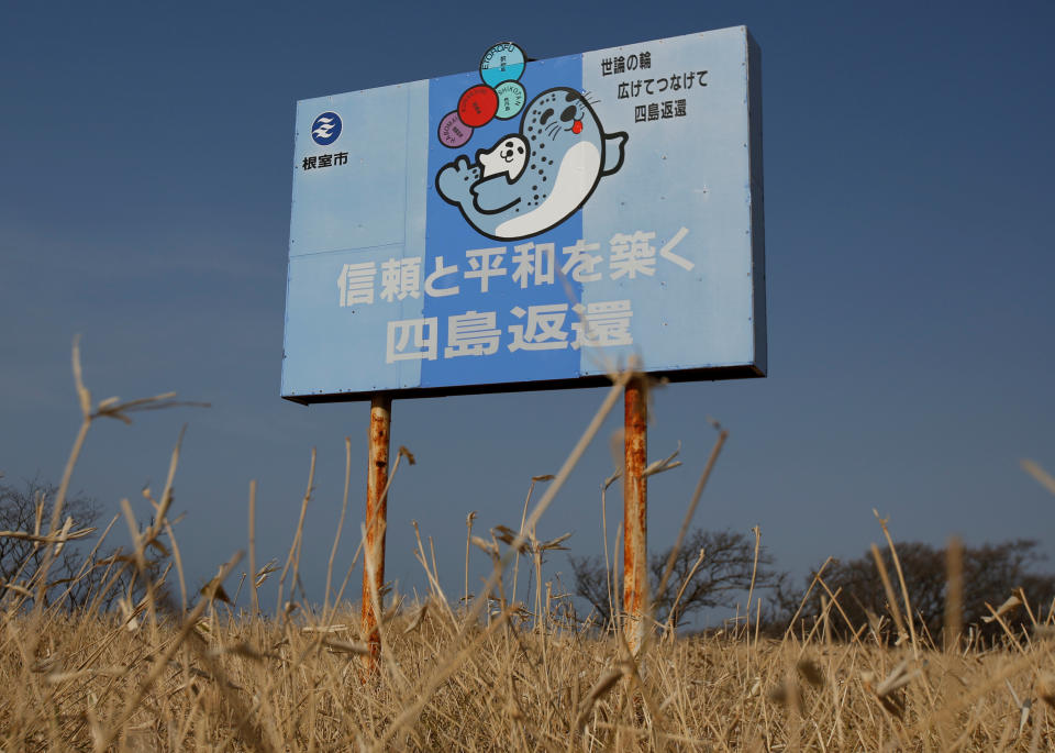 A message board reads messages demanding for the return of a group of islands, called Northern Territories by Japan and Southern Kuriles by Russia, is displayed in Nemuro, in Japan's nothern island of Hokkaido, April 14, 2017. REUTERS/Issei Kato