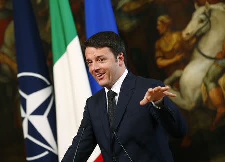 Italian Prime Minister Matteo Renzi talks during a joint news conference with NATO Secretary-General Jens Stoltenberg at the end of a meeting at Chigi Palace in Rome February 26, 2015. REUTERS/Tony Gentile