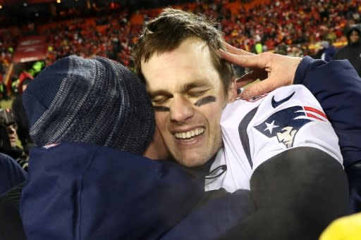 New England quarterback Tom Brady gets a hug after guiding the Patriots to a 37-31 overtime victory over the Kansas City Chiefs and into Super Bowl 53