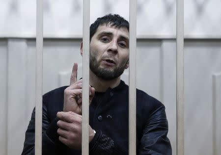 FILE PHOTO: Zaur Dadayev, charged with involvement in the murder of Russian opposition figure Boris Nemtsov, speaks inside a defendants' cage in Moscow, Russia March 8, 2015. REUTERS/Tatyana Makeyeva/File Photo