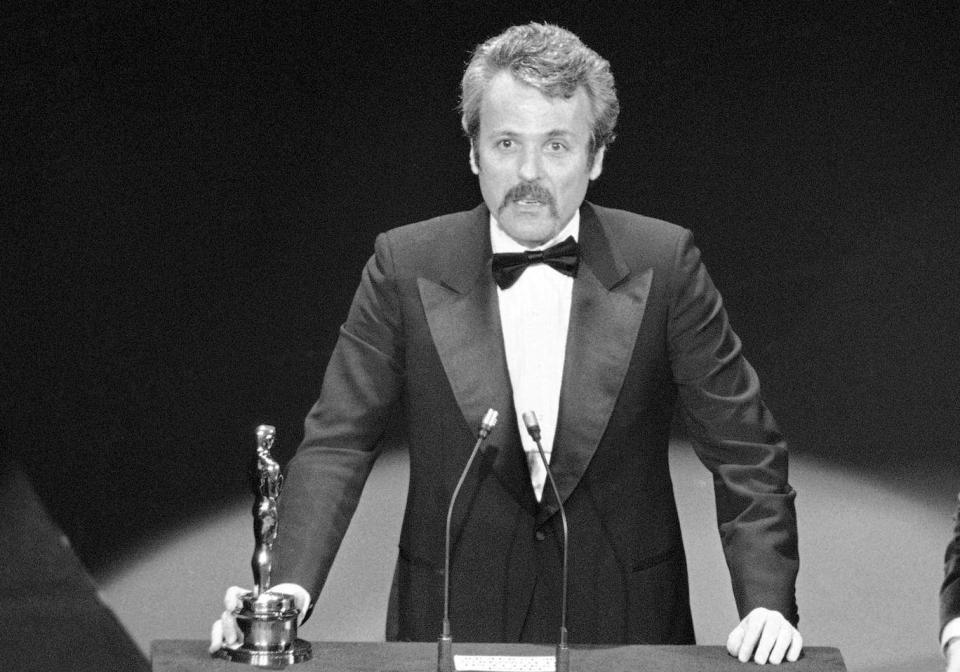 Goldman accepts his Oscar for ‘All the President’s Men’ in 1977 (AP)