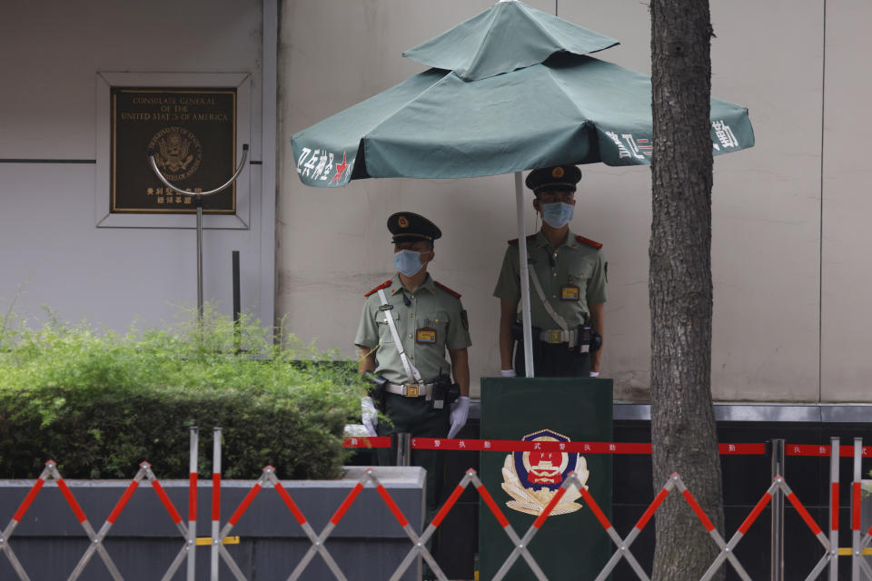Chinese paramilitary policemen stand guard outside the United States Consulate in Chengdu in southwestern China's Sichuan province Saturday, July 25, 2020. China ordered the United States on Friday to close its consulate in the western city of Chengdu, ratcheting up a diplomatic conflict at a time when relations have sunk to their lowest level in decades. (AP Photo/Ng Han Guan)