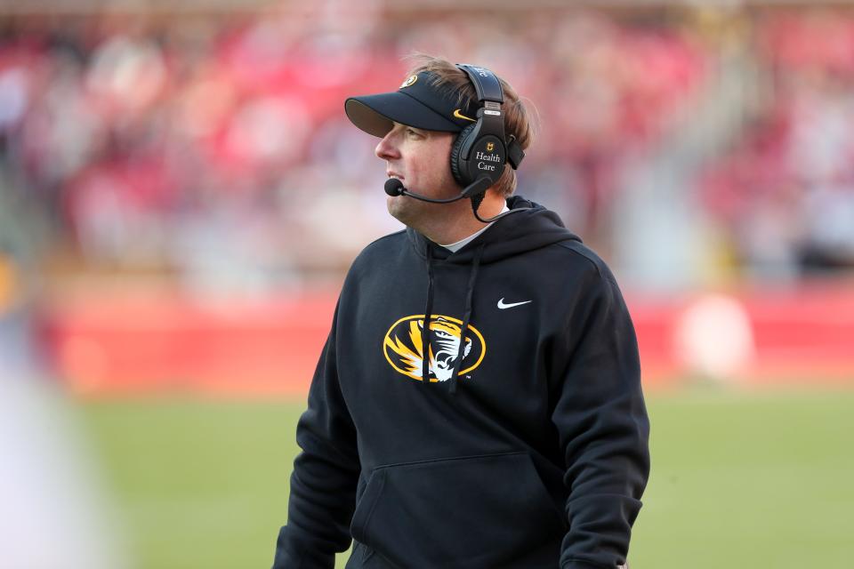 Nov 24, 2023; Fayetteville, Arkansas, USA; Missouri Tigers head coach Eli Drinkwitz looks on during the first quarter against the Arkansas Razorbacks at Donald W. Reynolds Razorback Stadium. Mandatory Credit: Nelson Chenault-USA TODAY Sports