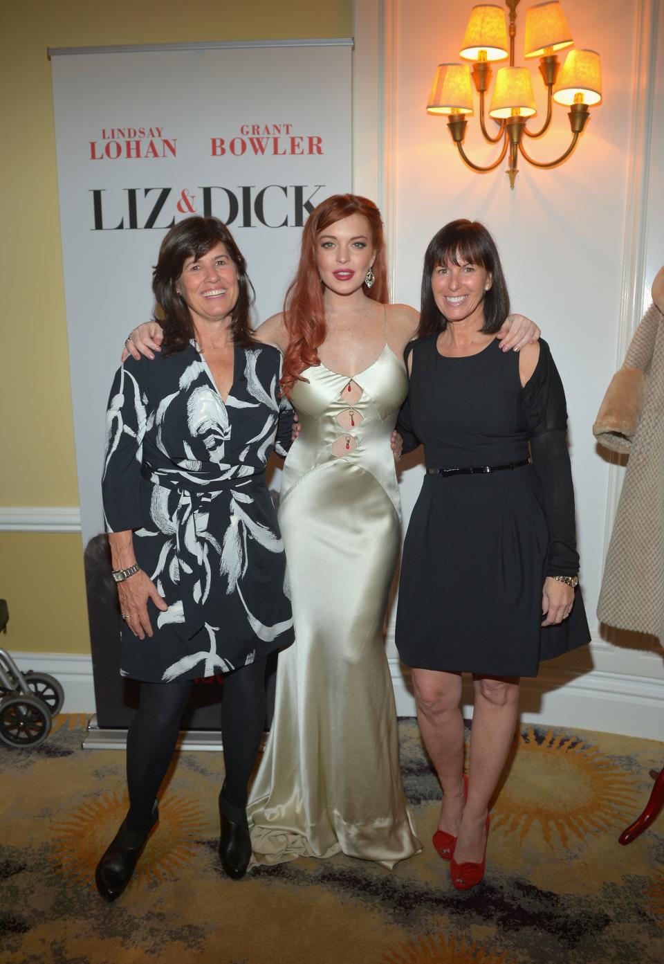 BEVERLY HILLS, CA - NOVEMBER 20: (L-R) Lifetime SVP Original Movies Tanya Lopez, actress Lindsay Lohan and Lifetime VP Original Movies Nancy Bennett attend a private dinner for the Lifetime premier of "Liz & Dick" at Beverly Hills Hotel on November 20, 2012 in Beverly Hills, California. (Photo by Charley Gallay/Getty Images for A&E Networks)