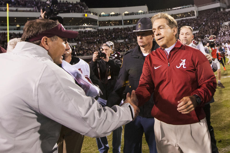 Alabama coach Nick Saban, right, shakes hands with Mississippi State coach Dan Mullen after Alabama’s 31-24 win. (AP)