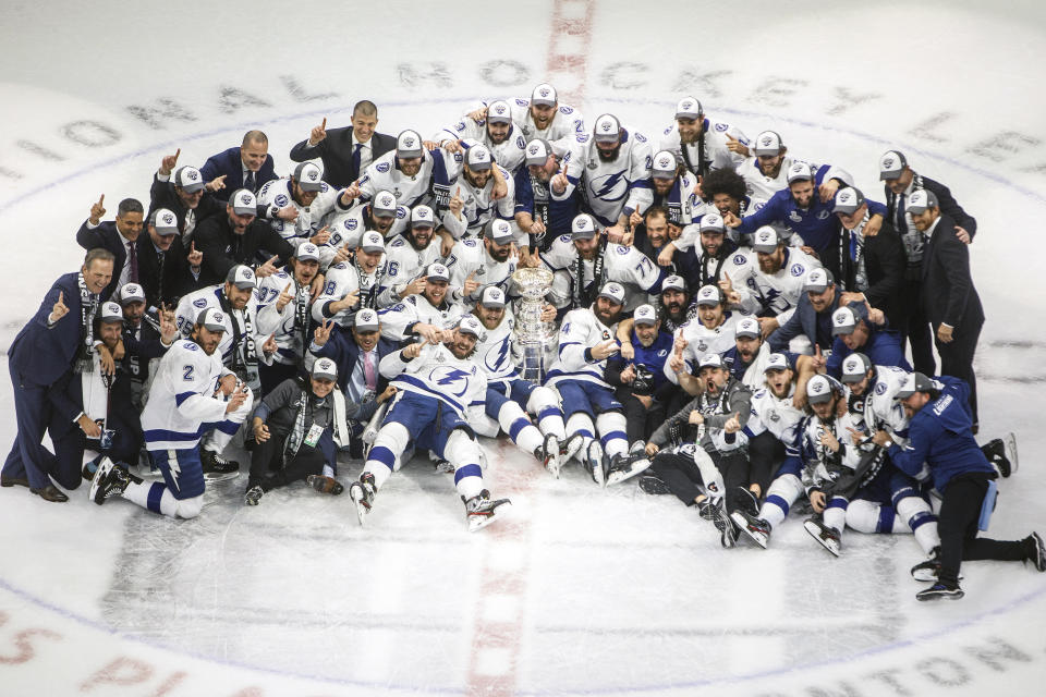 Tampa Bay Lightning players celebrate their Stanley Cup win over the Dallas Stars at the NHL Stanley Cup hockey finals in Edmonton, Alberta, on Monday, Sept. 28, 2020. (Jason Franson/The Canadian Press via AP)