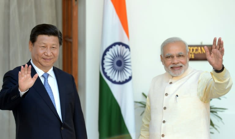 Despite Prime Minister Narendra Modi's (R) reported attempts to convince Chinese President Xi Jinping to support India's membership in the 48-nation Nuclear Suppliers Group, Beijing stands firm in its opposition