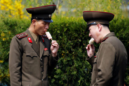 FILE PHOTO: Soldiers enjoy ice-cream in Pyongyang, North Korea April 16, 2017. REUTERS/Damir Sagolj/File Photo