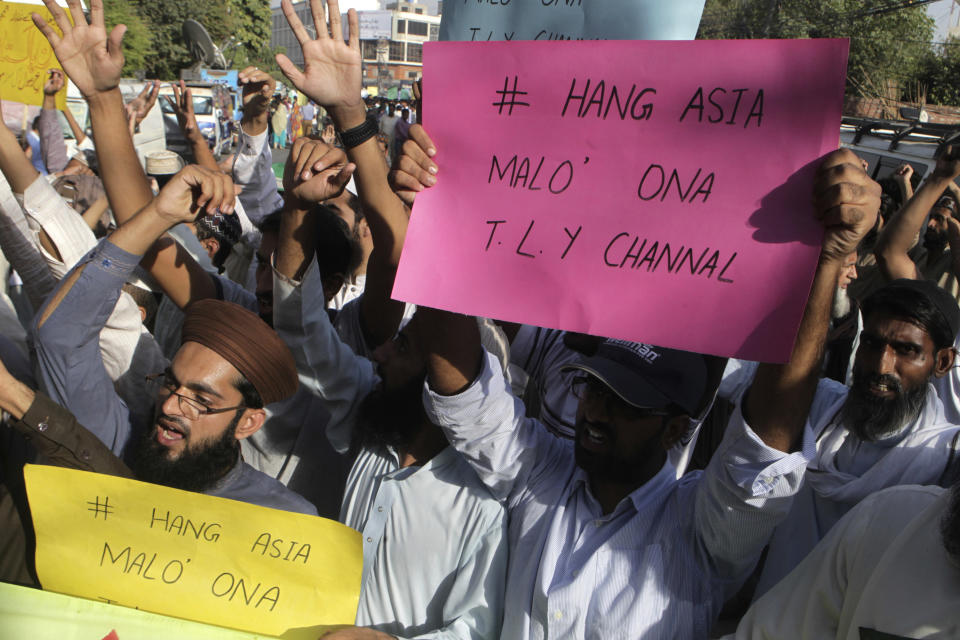 FILE - In this Oct. 13, 2016, file photo, supporters of a Pakistani religious group shout slogans demanding hanging of a Christian woman, Aasia Bibi in Lahore, Pakistan. Pakistan's Supreme Court is set to hear the final appeal of the Christian on death row since 2010 accused of insulting Islam's prophet, a crime that incites mobs to kill and carries an automatic death penalty. (AP Photo/K.M. Chaudary, File)