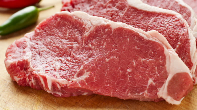 Raw steak on a cutting board