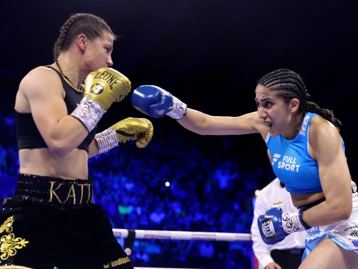 Katie Taylor (left) defending her titles against Karen Elizabeth Carabajal  (Getty Images)