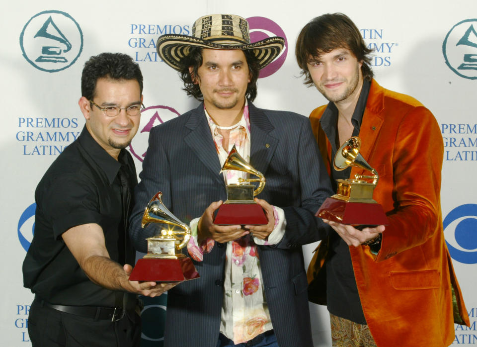 Jorge Villamizar (C) J.J. Freyde (L) and Andre Lopez of Bacilos
celebrate their winning the Best Pop Album by a Duo or Group with Vocal
award at the Latin Grammy Awards in Miami, September 3, 2003.
REUTERS/Daniel Aguilar

HK